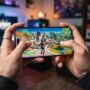 A person playing Fortnite free on an iPhone using cloud gaming services.