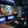 Gamer playing action game online free showing digital earnings on screen.