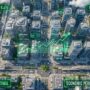 Top down view of a simulated city skyline with glowing financial stats.